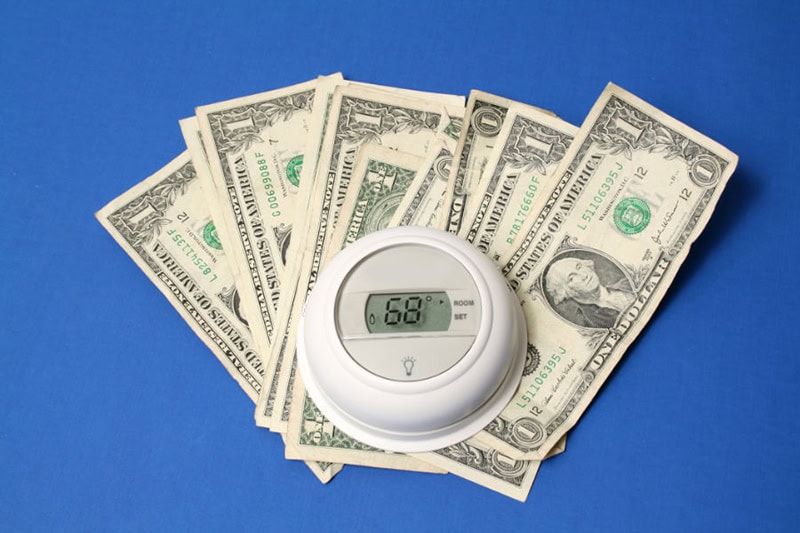 thermostat on top of money.