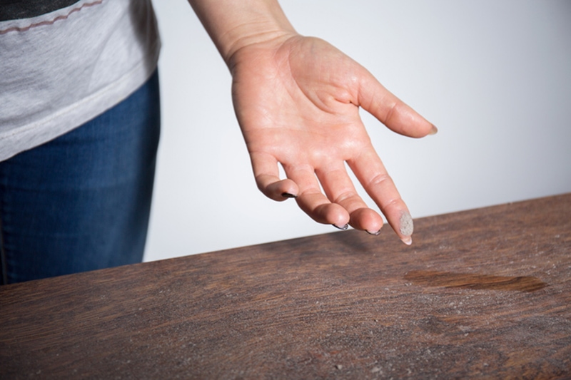 Close-up of dust on woman finger How to Eliminate Dust in My Home | Westford, MA | Basnett Plumbing